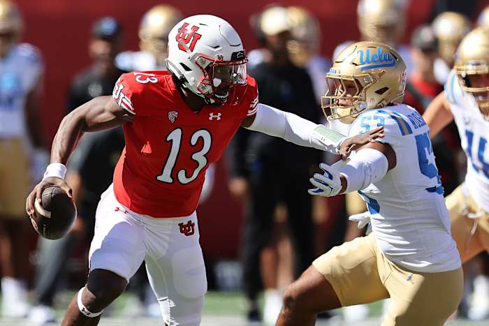 Sep 23, 2023; Salt Lake City, Utah, USA; Utah Utes quarterback Nate Johnson (13) is chased by UCLA Bruins linebacker Darius Muasau (53) in the first quarter at Rice-Eccles Stadium. Mandatory Credit: Rob Gray-USA TODAY Sports